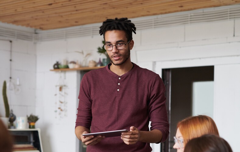 Photo Of Man Standing In Front Of People 3182829