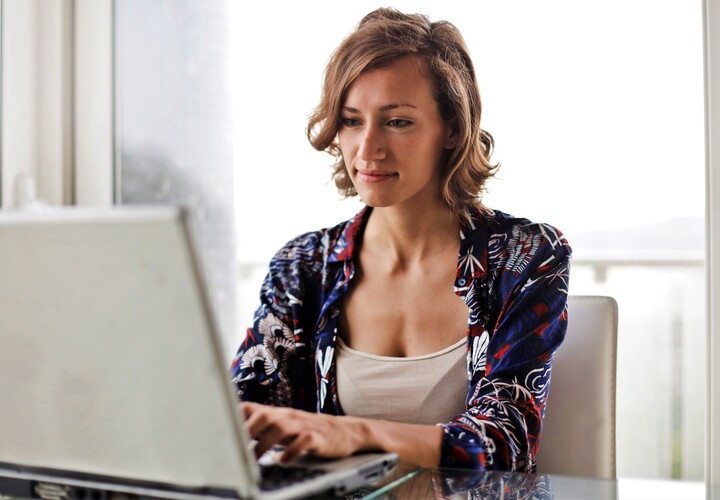 Woman In Blue Floral Top Sitting While Using Laptop 806835 (2)