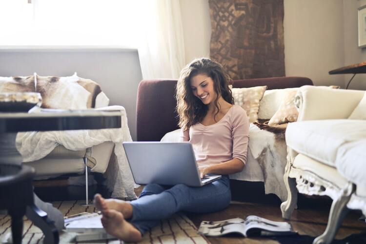 Woman Smiling While Using Laptop 3769717